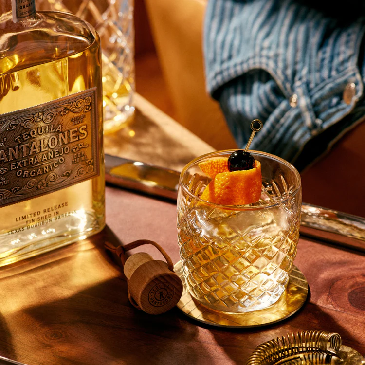 Pantalones Tequila Extra Anejo bottle with a crafted cocktail